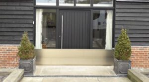 A front door in Plymouth being protected by a flood barrier from Lakeside Flood Solutions
